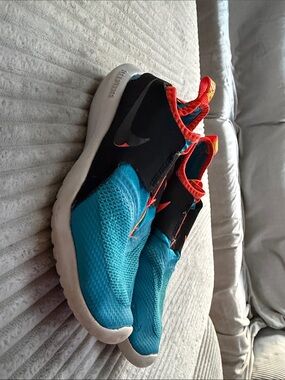 Nike Kids Turquoise and Black Slip-On Sneakers with Orange Accents